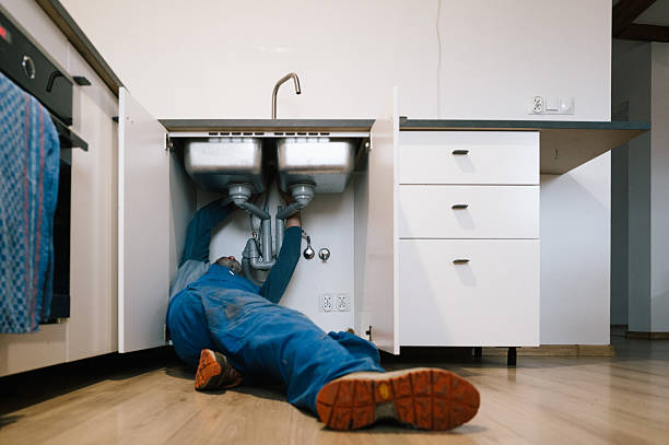Professional Drain Cleaning technician working in Schroon Lake, NY